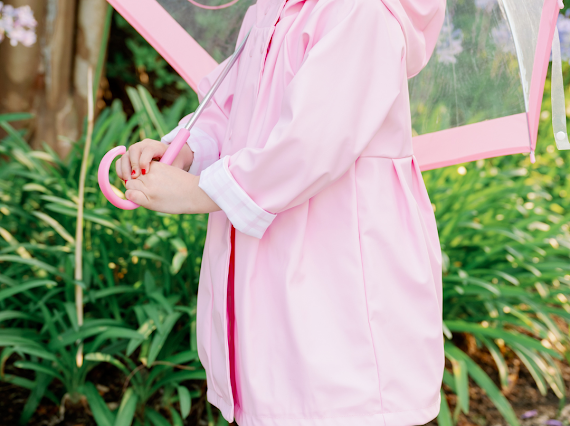 pink raincoat with check